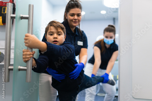 Photos Scared teenager trying to escape from the dentist's office