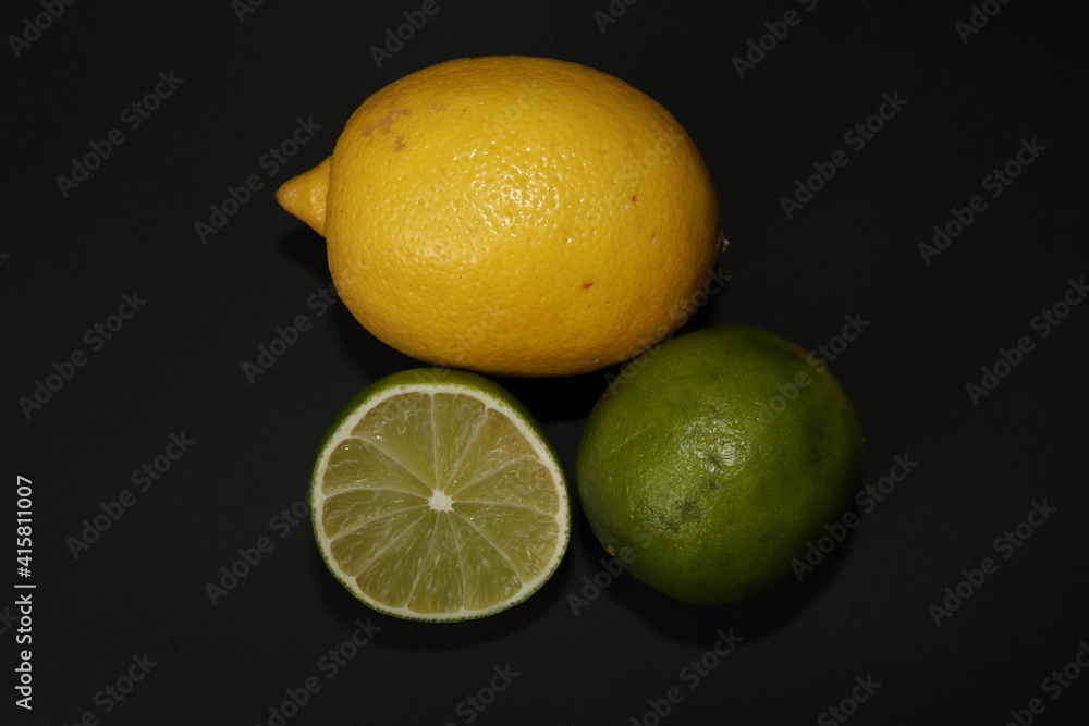 Grapefruit, orange, lemon and lime isolated on a black background. Citrus fruits in the section. Citrus slices. Still life of fruit. Grapefruit, orange, lemon and lime isolated on a black background. Citrus fruits in the section. Citrus slices. Still life of fruit.