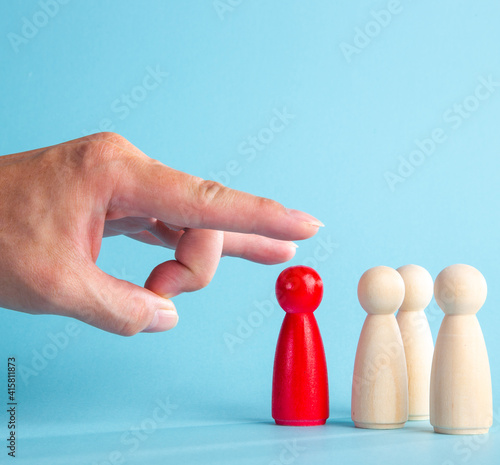  The boss’s big hand flicking the dismissed employee.Crisis and unemployment, humiliating dismissal.