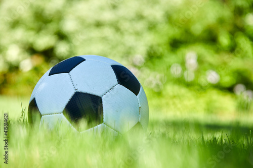 close-up view of leather soccer ball on green grass © fox17