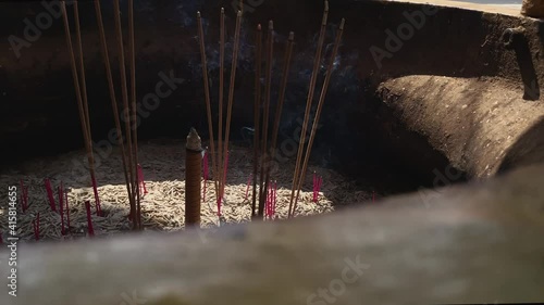 4K slow motion moving
Buddhist prayer sticks burning in the censer.Red incense