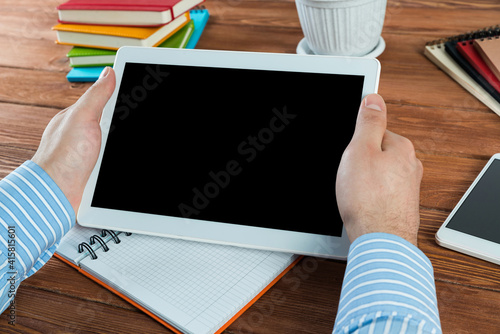 businessman with a tablet, works in the office