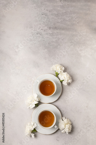 Two cups of tea for March 8th in flowers © Anastasiya