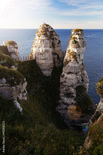 An impressive view of rocky cliffs on the ocean.