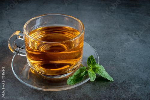 Cup of hot  tea and Mint leaves, Healthy drink concept
