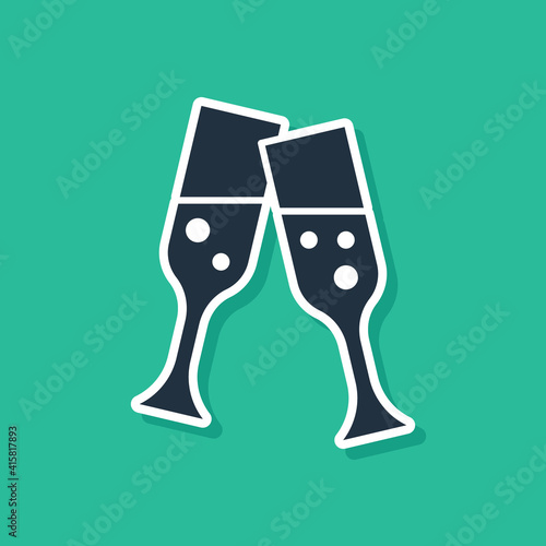 Blue Glass of champagne icon isolated on green background. Vector.