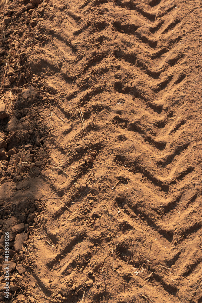 Tractor tracks on arid and dry terrain