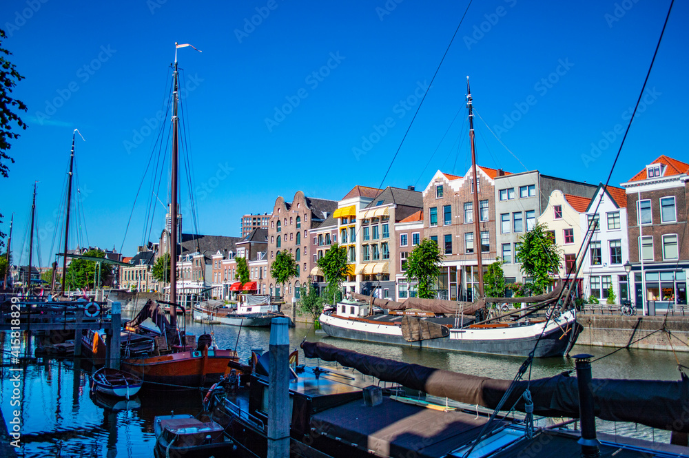 Rotterdam, Netherlands - July 5, 2019: Old historical Durch houseboats in Delfshaven district of Rotterdam