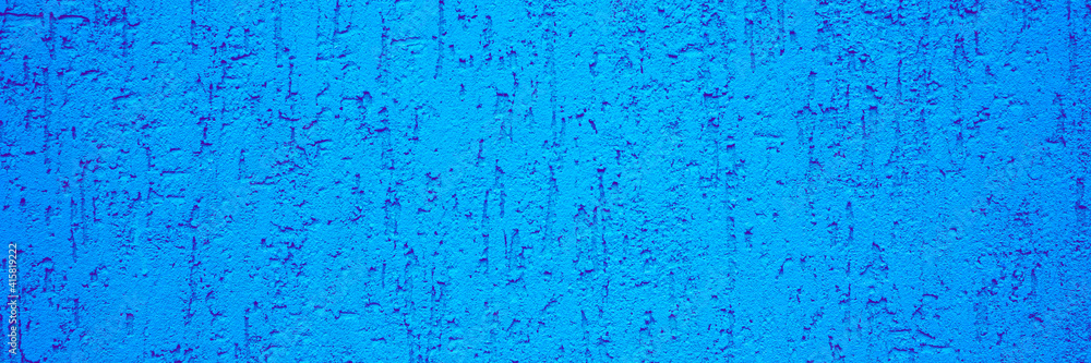 Background of blue stone wall with stucco drips closeup
