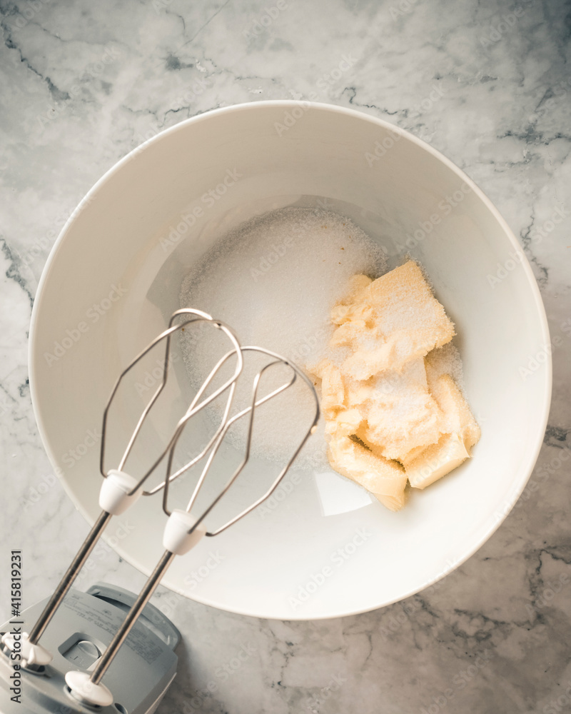 butter and sugar in a bowl which are then mixed, cooking technique butter and sugar in a bowl which are then mixed, cooking technique