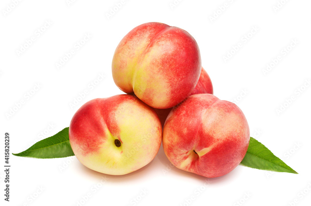 Heap of whole peaches with leaves isolated on white background Heap of whole peaches with leaves isolated on white background