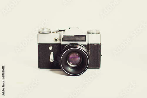 Vintage film camera isolated on white background with copy space.