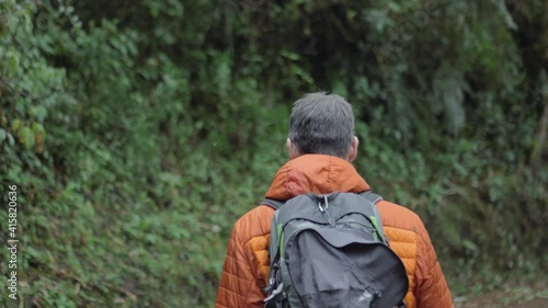 Male model with couple walking in the nature inca trail, peru, vilcabamba, slownmotion photo