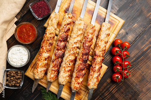 lula kebab with vegetables on cutting board