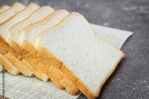 Sliced bread on dark grunge...