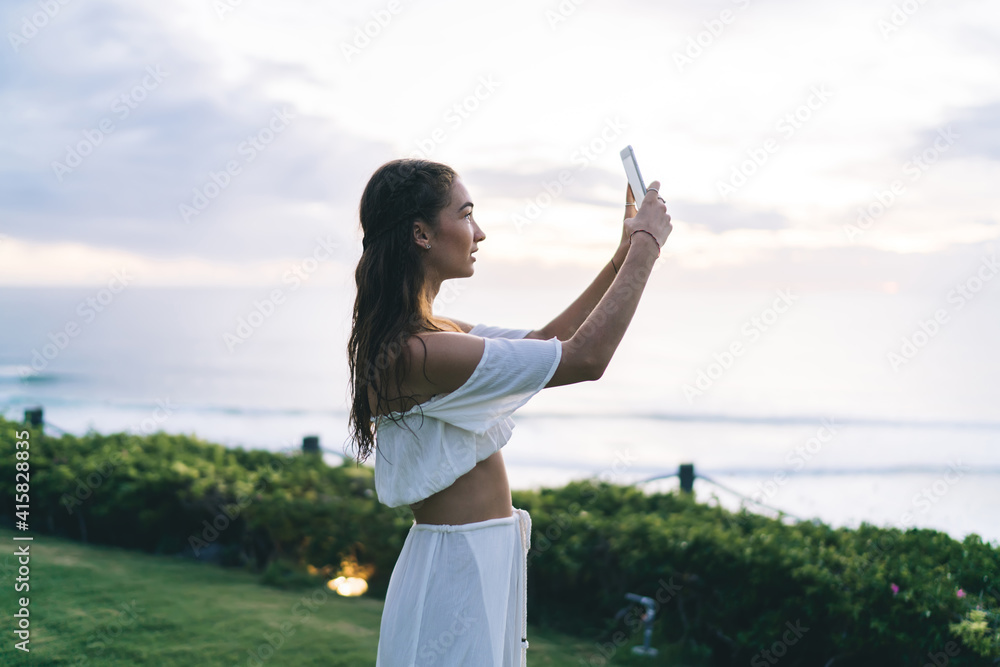 Delighted woman taking selfie on exotic coastline Delighted woman taking selfie on exotic coastline