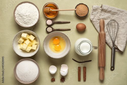 Baking ingredients on a beige concrete background. View from above.