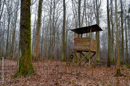 hunting tower made by wooden planks in forest