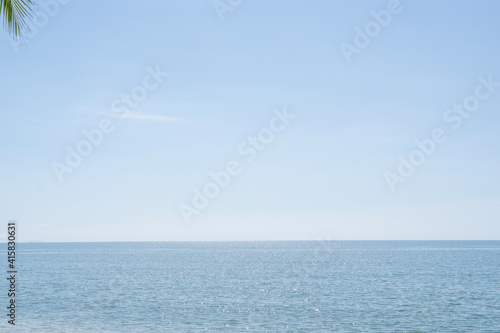 Beautiful sky over sea with sunlight. Tranquil sea harmony of water surface. Sunny sky and blue ocean.
