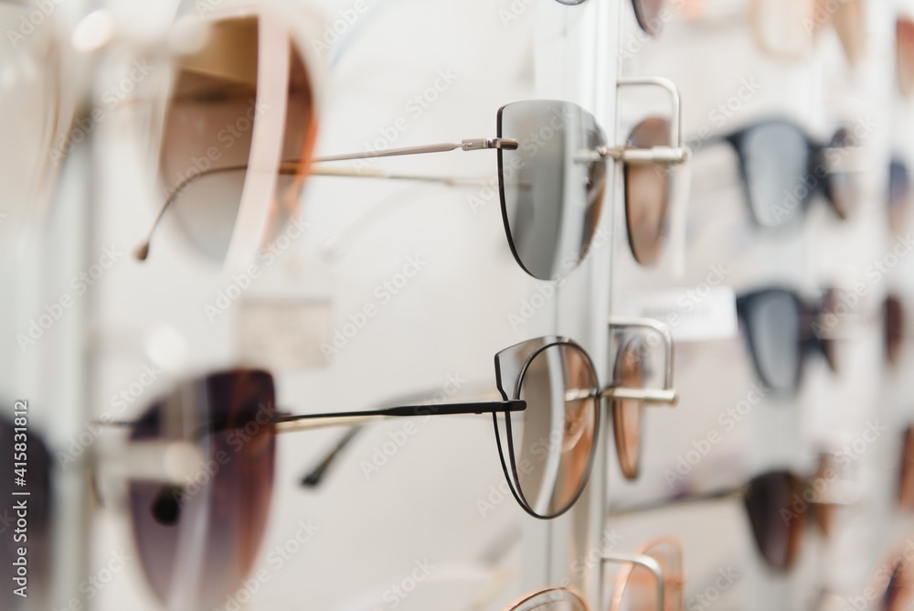 rack with glasses and sunglasses close up rack with glasses and sunglasses close up