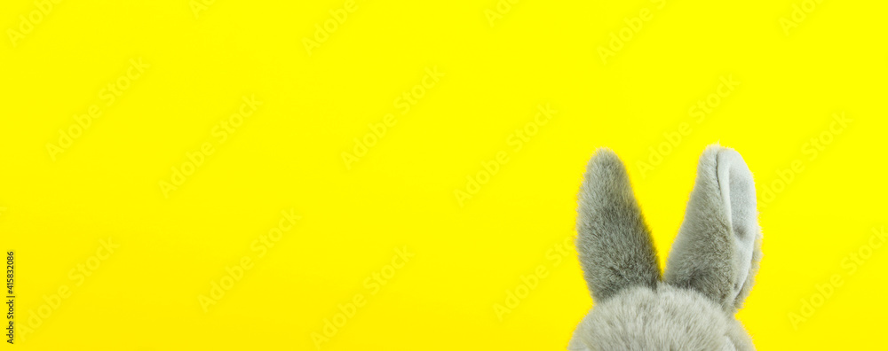 Fototapeta Easter Bunny. Close-up of bunny ears on Yellow Background.