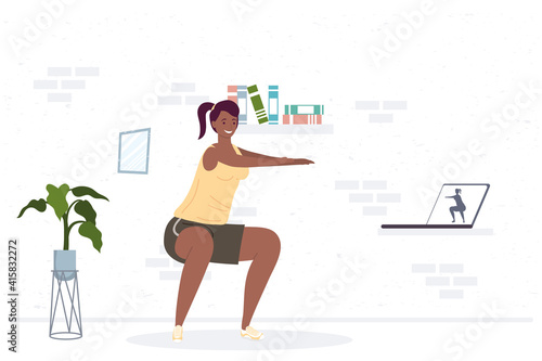 athletic afro woman practicing exercise in the house