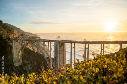 Bixby Creek Bridge along Big Sur coast during golden sunset