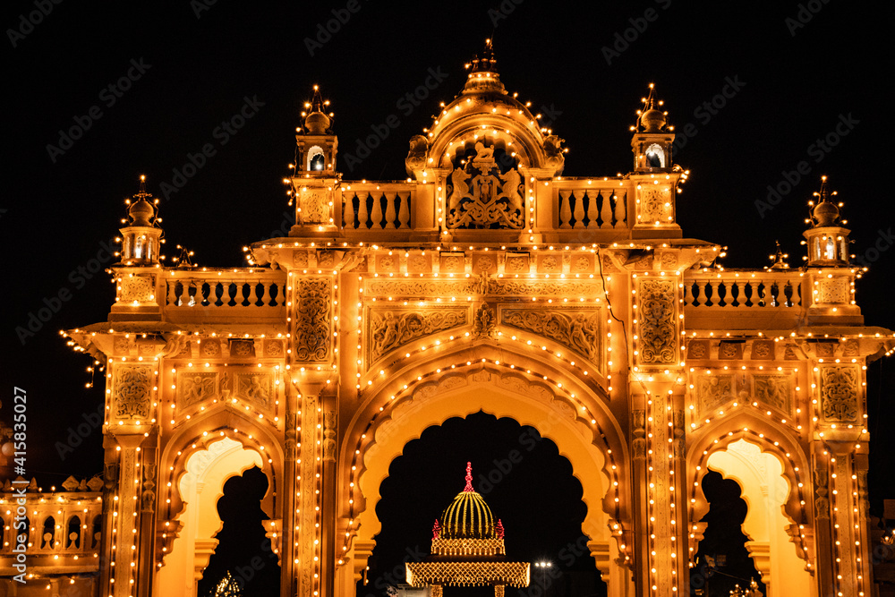 kings living royal palace vintage entrance gate illuminated at night with tungsten bulb