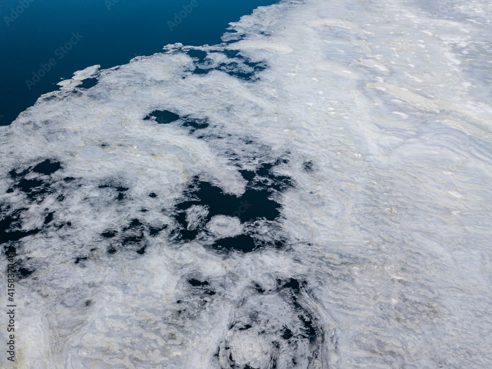 Ice edge on the river. Aerial drone view. Snowy sunny morning. Ice edge on the river. Aerial drone view. Snowy sunny morning.