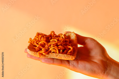 close up of a hand holding a slice