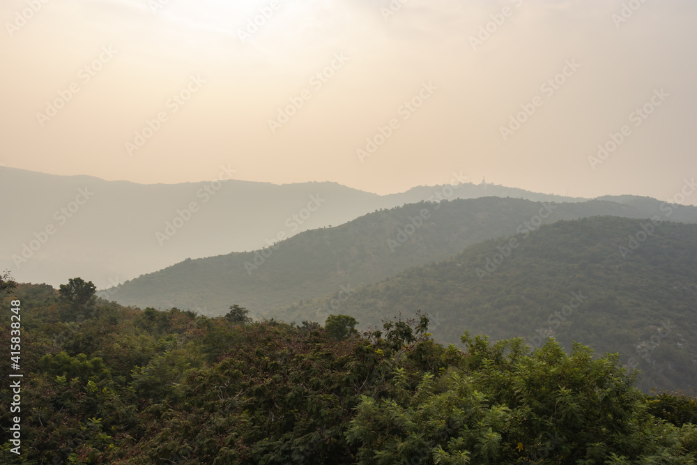 mountain range with white mist view at dawn