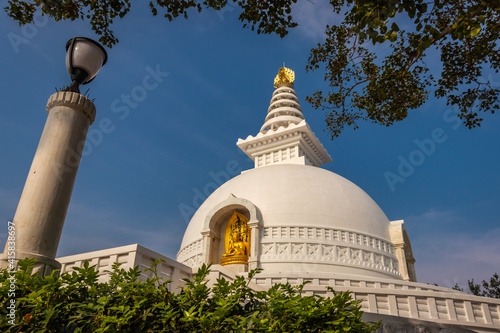 Canvas Print buddhist stupa isolated with amazing blue sky from unique perspective