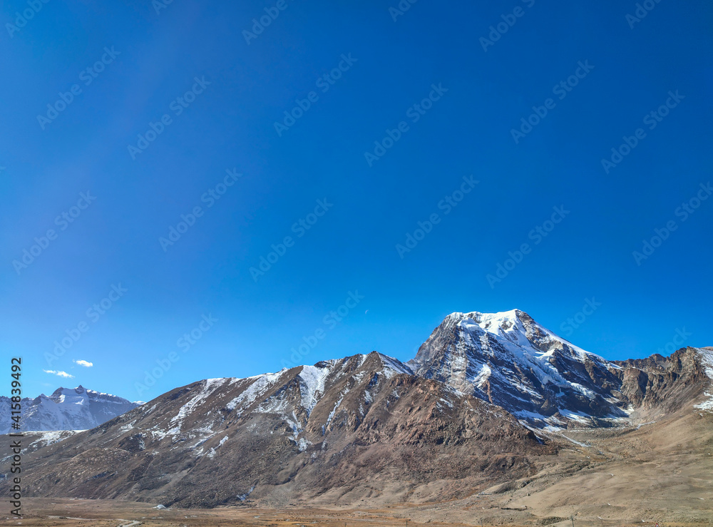 himalayan snow peak mountains with blue bright sky