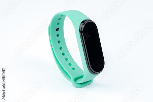 smart fitness bracelet with colored strap isolated on white background