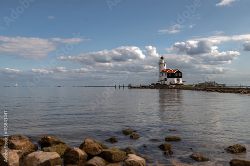 White lighthouse on the former island of Marken named 'The horse of Marken' in the Netherlands. photo