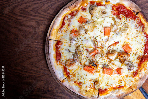 Pizza baked in wood oven, Thin crust pizza with seafood ,top view with copy space