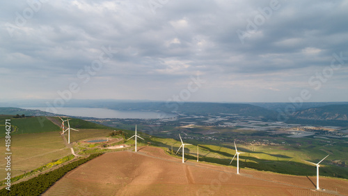Wind farm in the countryside with Sea of Galilee in the background