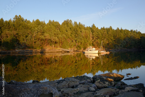 Boats at the dock in Conover Cove, Wallace Island, Gulf Islands, British Columbia, Canada photo