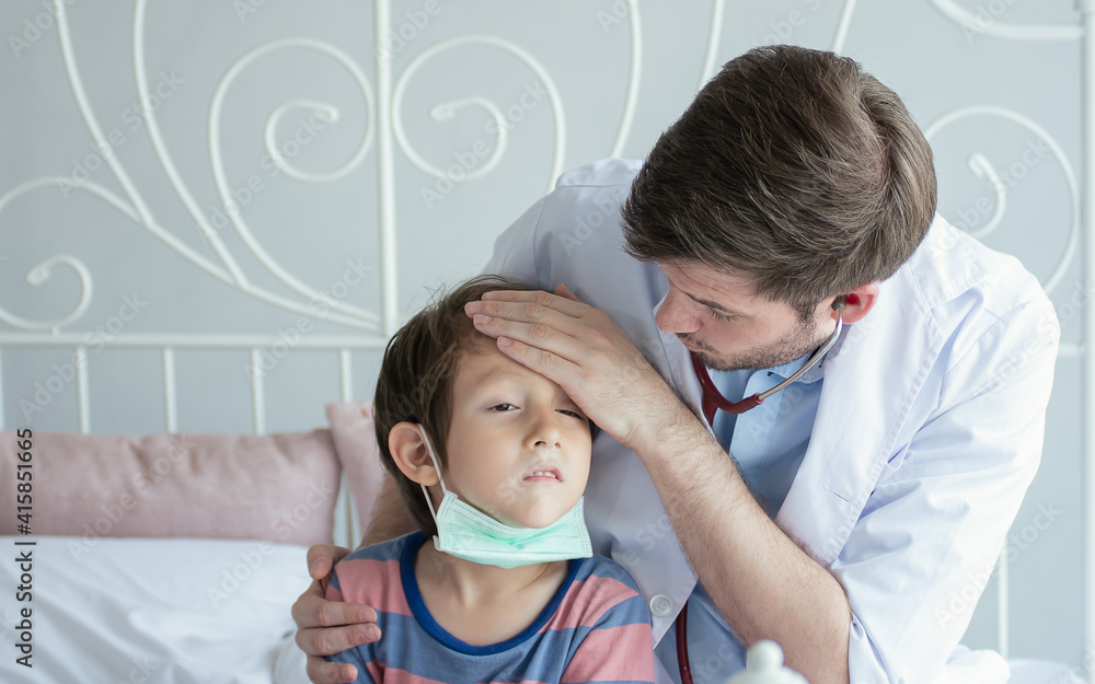 Fototapeta premium A doctor examine little boy after getting sick