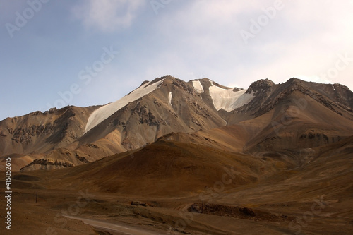 Panorama of the Mountains at the Ak-Baital pass with view on snowy high mountains and valley. View on the mountains in Pamir highway in Tajikistan