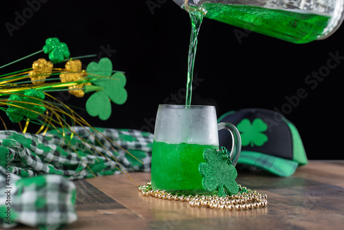 Pouring green beer into a frosty mug