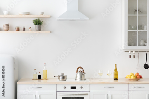 Bright kitchen interior in modern apartment for rent, sale and blogging © Prostock-studio