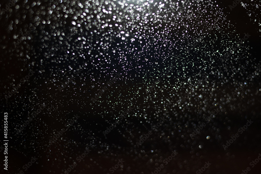 Blurred background with raindrops and lights. Blurred background with raindrops and lights.