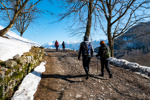 Trekking scene on Lake Como alps photo