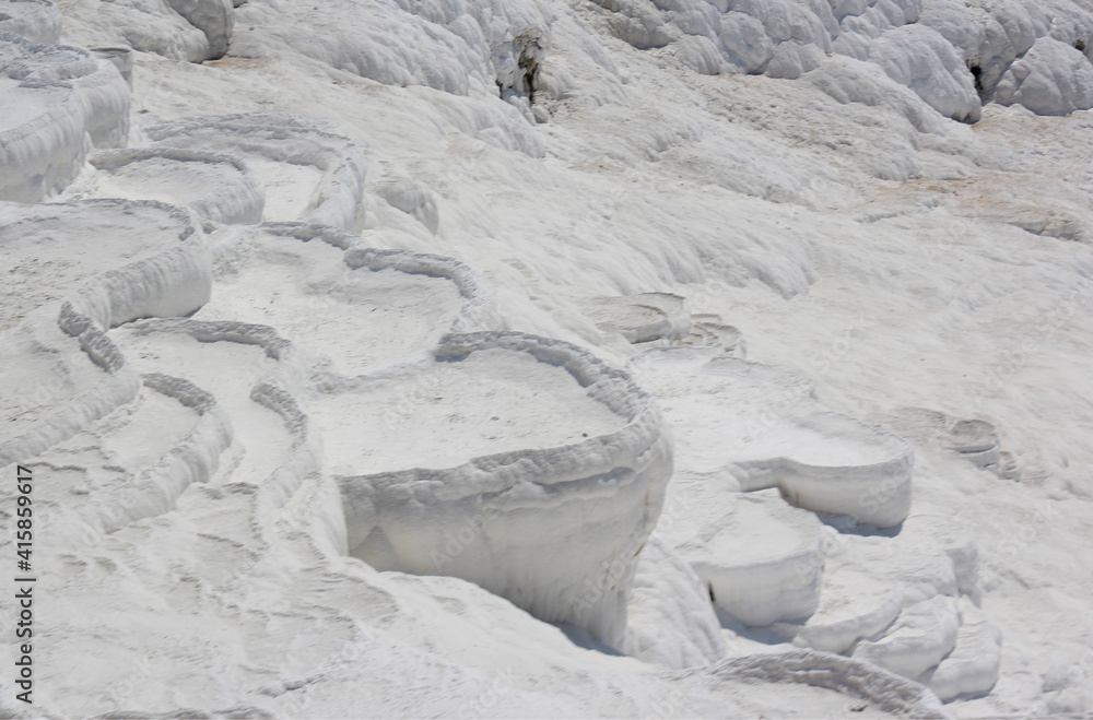 Fototapeta premium the background image of the topography of the Pamukkale travertines