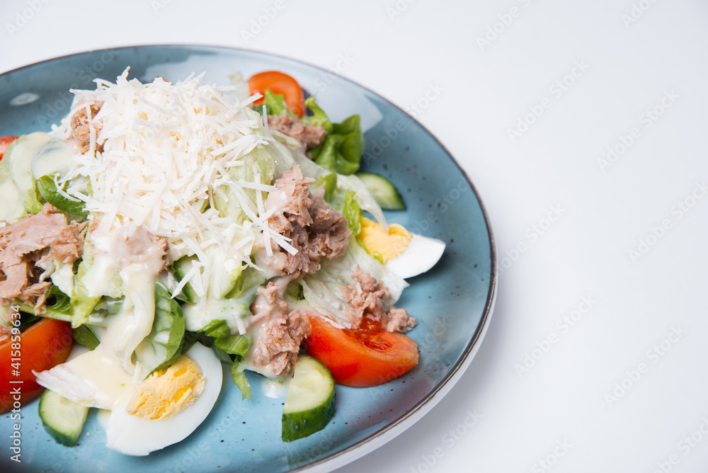 Close up photo of tasty fresh salad with ton eggs and grated cheese. Close up photo of tasty fresh salad with ton eggs and grated cheese.