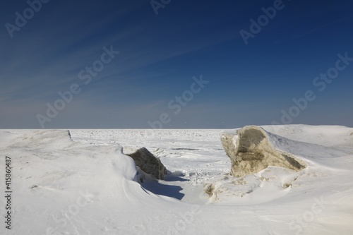 Ice hills on the frozen lake © Douglas