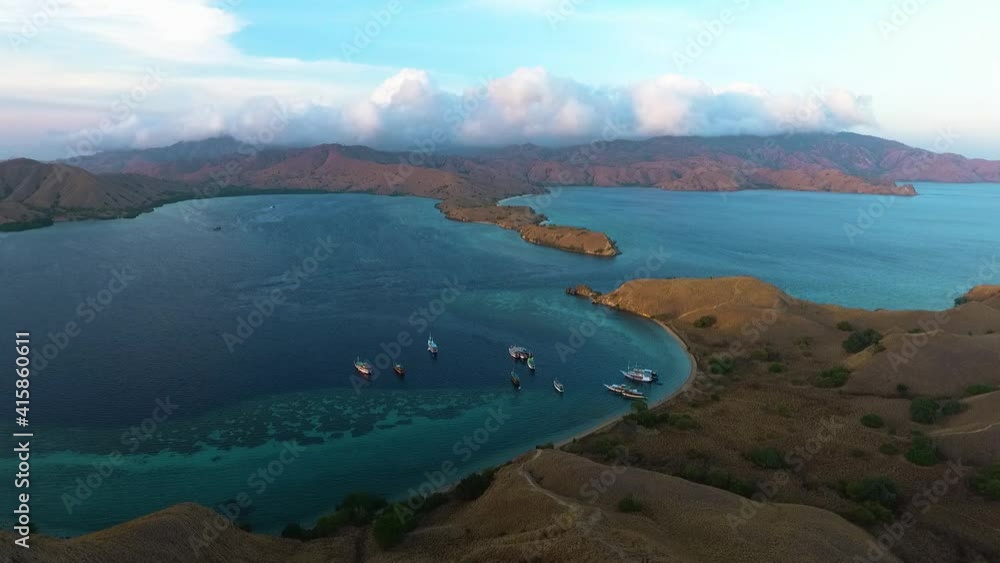 aerial view of komodo national park flores island indonesia, travel touristic destination cruise boat park in the bay pristine clear ocean water gorgeous archipelago holiday paradise aerial view of komodo national park flores island indonesia, travel touristic destination cruise boat park in the bay pristine clear ocean water gorgeous archipelago holiday paradise