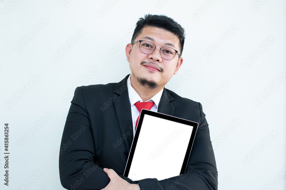 Expert in digital technologies. Cheerful young man in formal wear working on digital tablet and smiling while standing isolated on white background Expert in digital technologies. Cheerful young man in formal wear working on digital tablet and smiling while standing isolated on white background