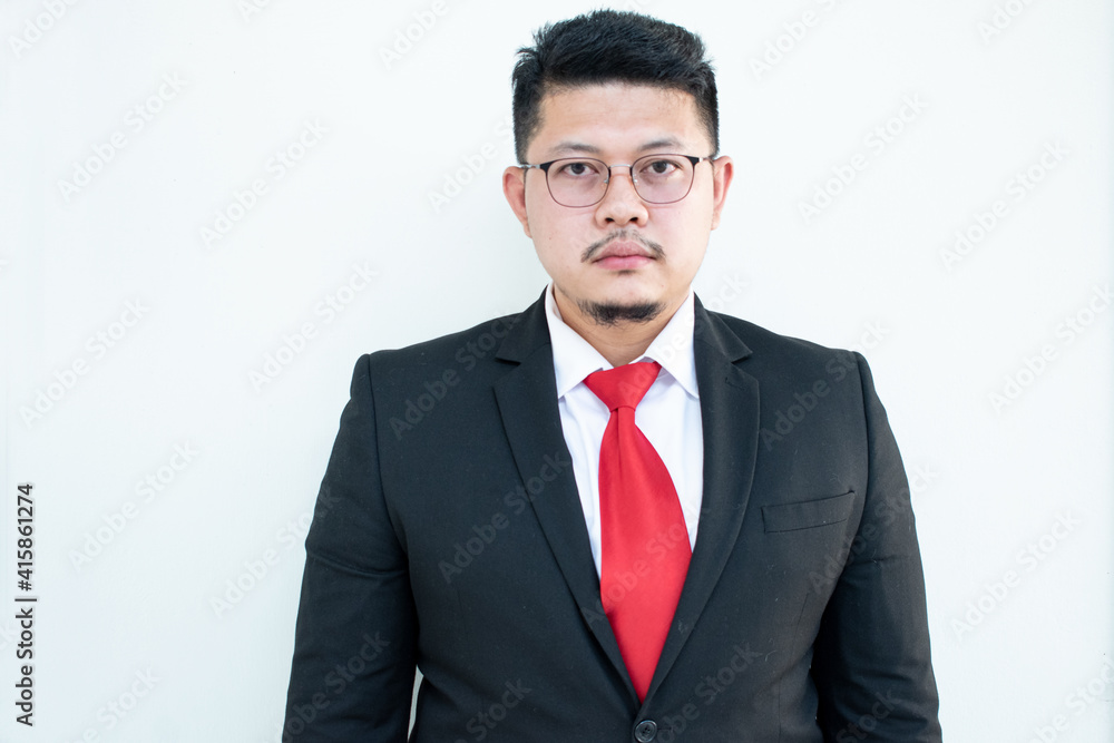 Handsome young business man wear glasses red tie in a suit and west. Handsome young business man wear glasses red tie in a suit and west.